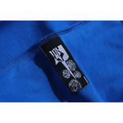 Royal blue Sp5der Summer Sports T-shirt showing a close-up of the brand tag detail on the premium performance fabric.