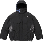 A black Supreme x Sp5der technical snowboard jacket featuring white web print graphics and collaborative brand logos.