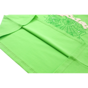 Close-up view of the hem and vibrant green fabric of a Sp5der Wait Web t-shirt with signature spider web graphic.