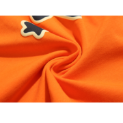 Close-up view of the orange fabric detail for the Sp5der Worldwide Star Beluga T-Shirt showing premium texture.