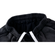 Sp5der cut sweatshort in black with a detailed shot of the elastic waistband and white drawstring design features.