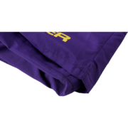 A close-up of the purple Sp5der SP5 Pro shorts featuring the signature yellow Sp5der branding and athletic fabric.