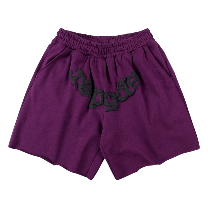 Front view of purple Sp5der OG Web Logo sweat shorts featuring a relaxed fit, soft fleece fabric, and iconic branding.