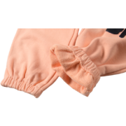 Close-up view of the elasticated cuff detail on the vibrant peach Sp5der Bellini sweatpants for a premium look.