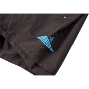 Close up of Sp5der embroidered logo and five-star print on stylish dark black performance sports shorts fabric.