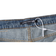 Sp5der AOP Vintage 501 Denim Jeans interior branding detail featuring a logo label and size tag on premium denim.