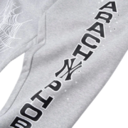 Sp5der Arach NY Phobia sweatpants in heather grey featuring bold black text graphics and an arachnid web design detail.