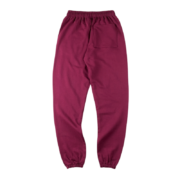 Back view of SP5DER Nocturnal Highway cotton track pants in a maroon colorway with a relaxed fit and pocket design.