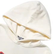 Close-up of the cream-colored hood detail on the Sp5der x Mariah the Scientist Scorpion limited edition hoodie.