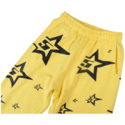 Sp5der 5Star sweatpants in vibrant yellow featuring bold black star graphic prints and a comfortable loose fit design.