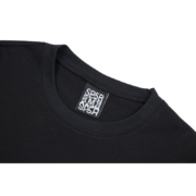 Close-up view of the branded neck tag label on the black Sp5der Young Thug Atlanta T-shirt, showing size medium.