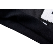 Close-up view of the premium black fabric texture and branding detail on the Sp5der Cut Sweatshort for a stylish look.