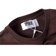 Brown Sp5der Sp5 Sex t-shirt showing the interior neck label detail and the authentic plastic hang tag attached.