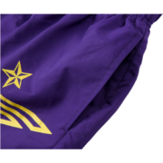 Close-up view of the purple Sp5der SP5 Pro Short featuring a yellow star logo and branded athletic detailing.