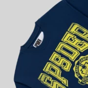 Close-up view of the front graphic print on the navy blue Sp5der Campus Tee from the Sp5der Archive collection.