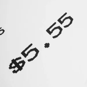 Close up view of the pixelated dollar sign graphic print on the front of the Sp5der Commerce Tee streetwear shirt.