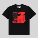 Front view of the SP5DER Black Toast Tee featuring a bold red bread tag graphic print with text on a black cotton shirt.