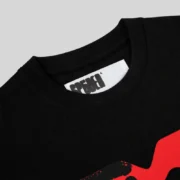Close up view of the black Sp5der Toast Tee shirt showcasing the iconic red SP5DER branding printed on the back neck.