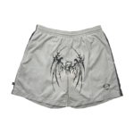 Light gray Sp5der streetwear shorts featuring a distinctive black graphic print and a comfortable elastic waistband.
