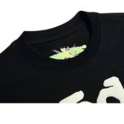 Sp5der Worldwide Star Beluga black T-shirt featuring a detailed green and white graphic on the inner neck collar tag.