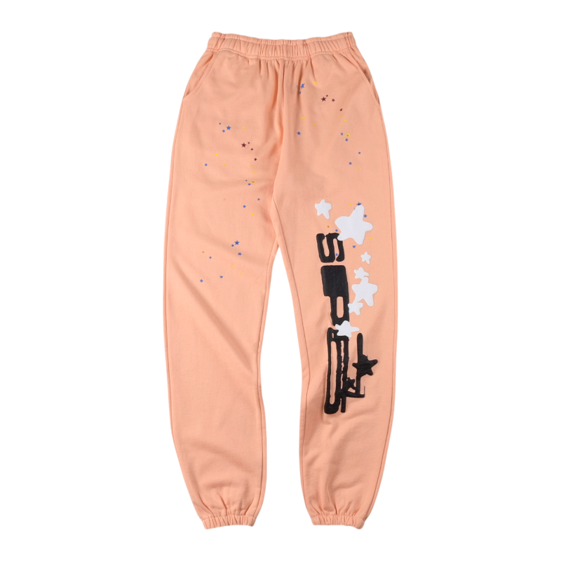Front view of the Sp5der Bellini sweatpants in a vibrant peach hue featuring a unique graphic logo and star detailing.