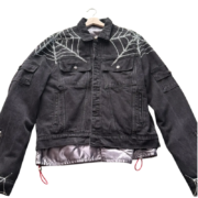 Sp5der Worldwide black denim jacket featuring signature rhinestone spider web detailing and a premium streetwear aesthetic.