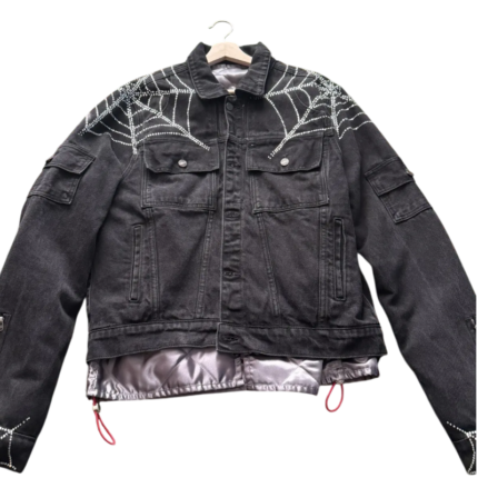 Sp5der Worldwide black denim jacket featuring signature rhinestone spider web detailing and a premium streetwear aesthetic.