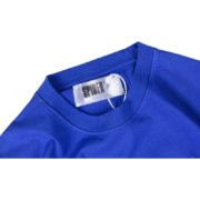 Royal blue Sp5der OG Web V2 tee showing the inside neck label detail and brand tag for streetwear authentication.