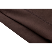 A detailed close-up showing the premium brown fabric and durable construction of the Sp5der OG Web Tee streetwear shirt.