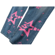 Sp5der 5Star Vintage 501 Denim jeans in blue featuring a distinct pink star pattern and premium distressed wash design.