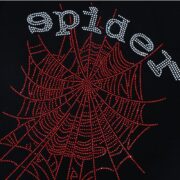 Close up of a black Sp5der Thug T-shirt featuring a detailed red rhinestone spider web graphic and logo text.