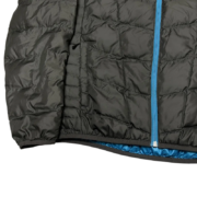 Close-up of the Sp5der Men’s Light Down Puffer Jacket featuring premium insulation and a stylish blue zipper detail.