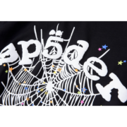 Close-up view of the white spider web and Sp5der brand graphic on a premium black cotton OG Web V2 streetwear t-shirt.