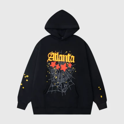 Black Sp5der Atlanta Star-Print Hoodie featuring a graphic web design and yellow stars in an oversized streetwear fit