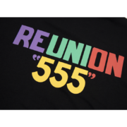 Close-up view of the Sp5der Reunion 555 T-shirt featuring the iconic colorful Reunion 555 graphic logo design.