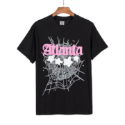 Sp5der Atlanta Print T-Shirt in black featuring a pink script logo and white web graphic with star design elements.