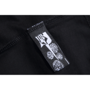Close-up view of the brand tag on a black Sp5der Worldwide Star Beluga T-shirt showcasing quality construction.