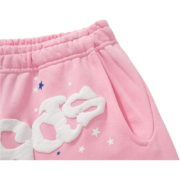 Detailed close-up view of the elasticated waistband and pocket design on the pink Sp5der Atlanta streetwear sweatpants.