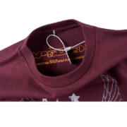 Close-up view of the SP5DER Worldwide 5EX Tee Shirt collar tag and interior branding details for authentication
