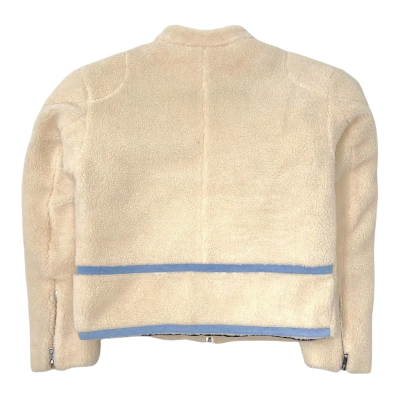 Back view of the cream-colored Sp5der Worldwide Hunters Sherpa Moto Jacket with blue stripe detailing and zip cuffs