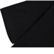 Close-up view of the premium fabric texture and construction on the black Sp5der Reunion 555 T-shirt sleeve detail.