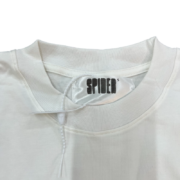 Close-up of the Sp5der OG Web V2 T-shirt inner neck label showing the brand logo on the white fabric collar design.