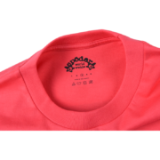 Close-up view of the inner neck label on the bright red Sp5der Bite Tee, featuring brand logo and size details.