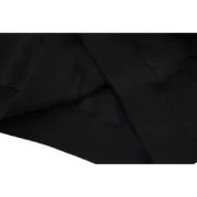Close-up detail of the premium black fabric and high-quality construction of the iconic Sp5der Web Hoodie in black.
