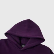 A detailed close-up of the signature purple Sp5der web hoodie featuring premium heavyweight cotton fleece fabric.