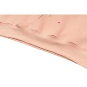 Close-up view of the premium baby pink fabric and quality stitching on the Sp5der SP5 Bellini hoodie statement piece.