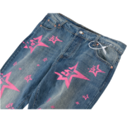 Sp5der 5Star Vintage 501 Denim jeans in blue with pink star print graphic pattern, front view of premium loose fit denim.