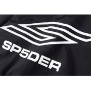 Close-up view of the white logo on the black Sp5der Pro Windbreaker jacket, showcasing the iconic branding detail.