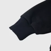 Close-up view of the black cuff detail on the limited edition Sp5der x Metro Boomin Heroes and Villains hoodie.