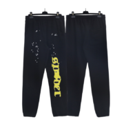 Front and back view of black Sp5der Jeffery sweatpants featuring white star detailing and yellow logo branding.
